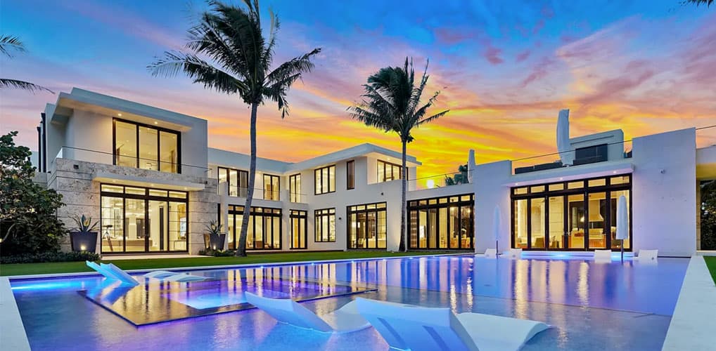 Luxury modern home with pool at sunset